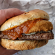 hand holding italian mozzarella burger